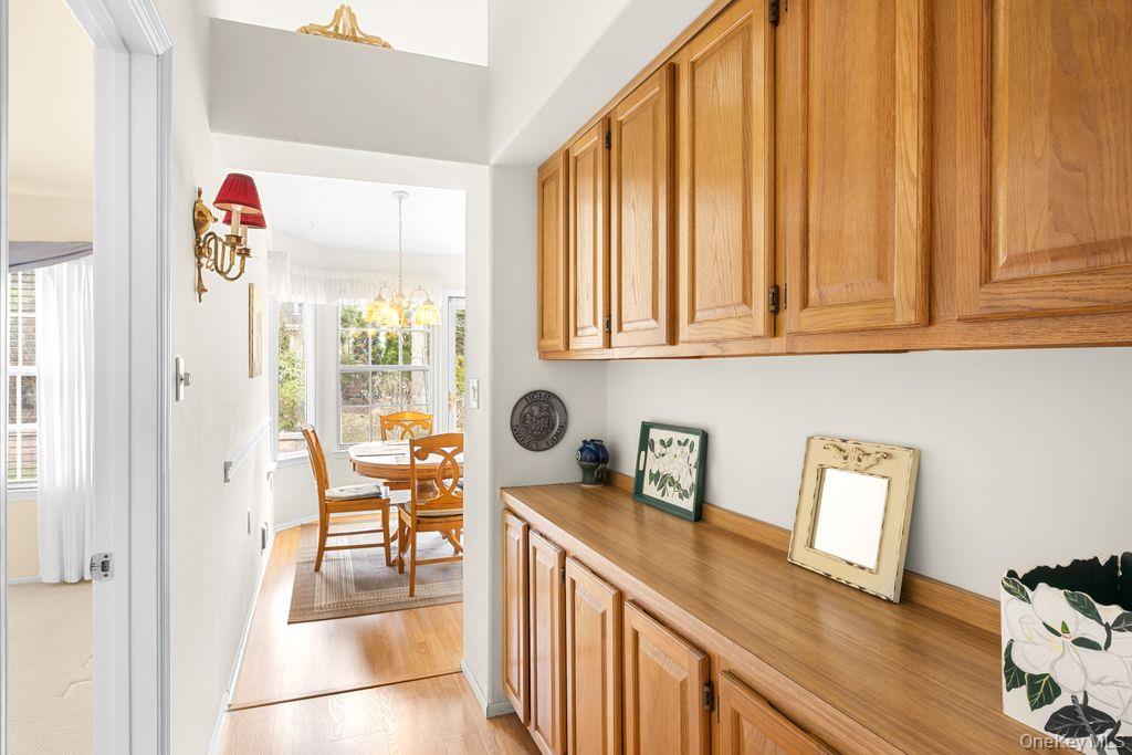 16 Huntington Court Ridge, NY 11961 - Photo 25 of 43 a hallway with a large window and sitting area
