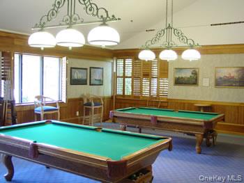 16 Huntington Court Ridge, NY 11961 - Photo 40 of 43 a room with pool table and windows