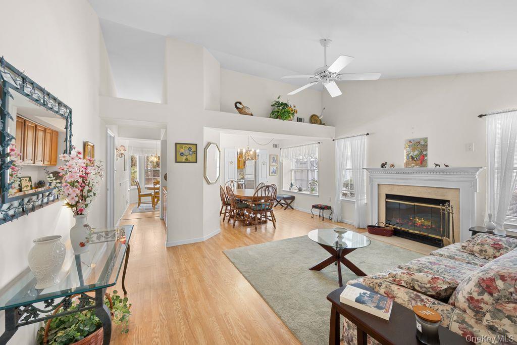 16 Huntington Court Ridge, NY 11961 - Photo 5 of 43 a living room with furniture and a fireplace