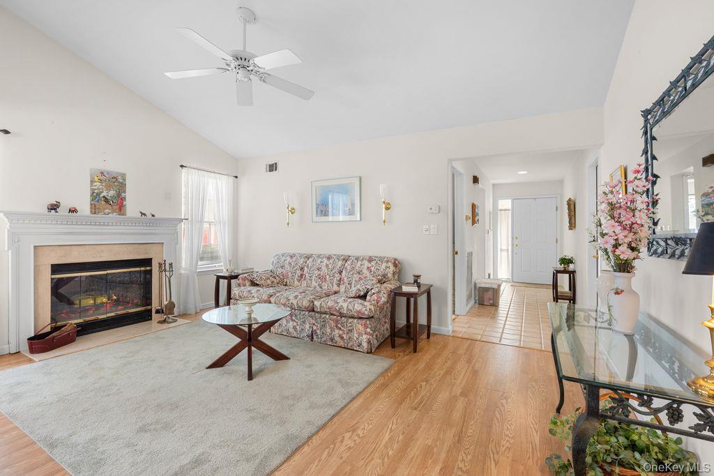 16 Huntington Court Ridge, NY 11961 - Photo 6 of 43 a living room with furniture and a fireplace