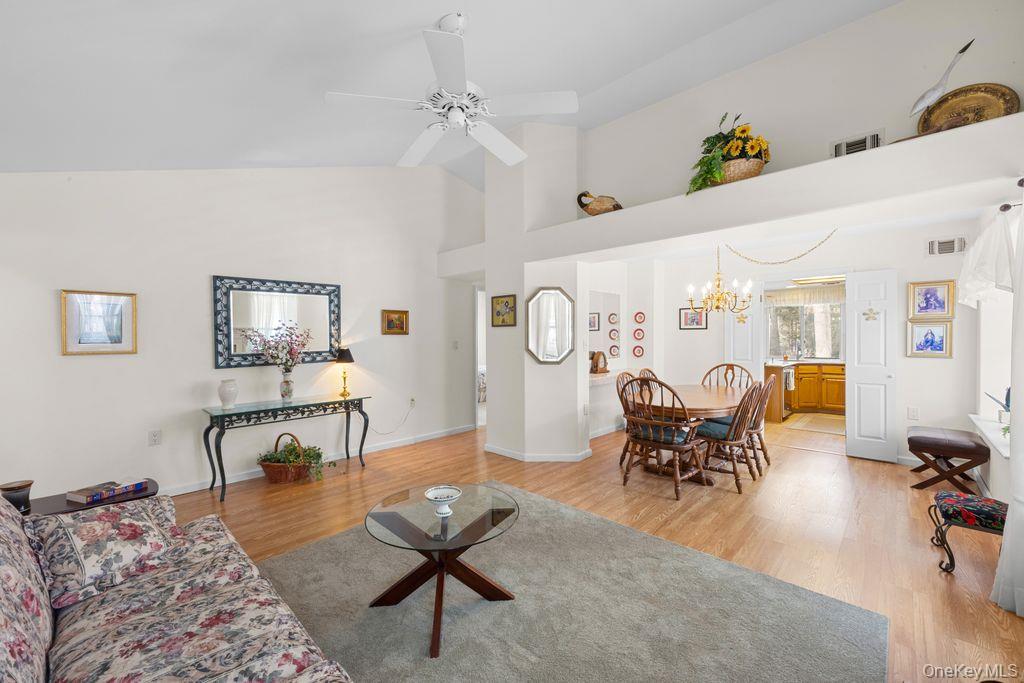 16 Huntington Court Ridge, NY 11961 - Photo 7 of 43 a living room with furniture and a table