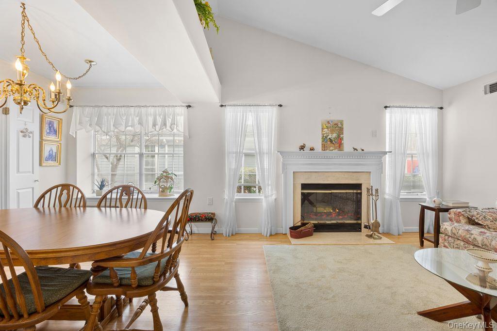 16 Huntington Court Ridge, NY 11961 - Photo 9 of 43 a bedroom with furniture and a fireplace