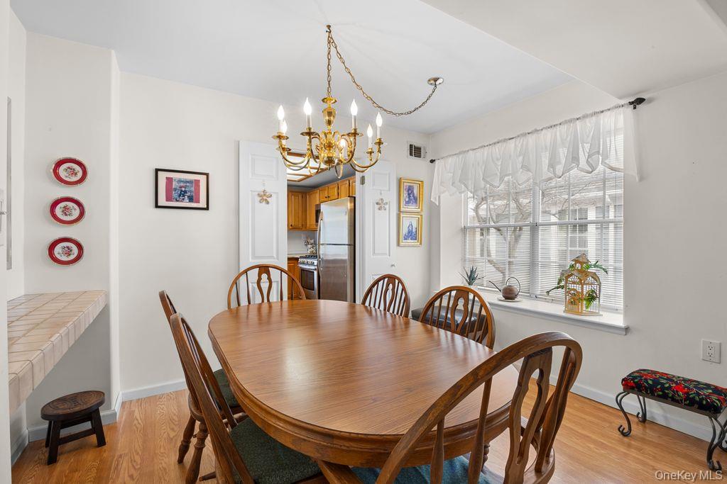 16 Huntington Court Ridge, NY 11961 - Photo 10 of 43 a dining room with furniture and window