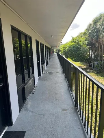 a bedroom with a bed and a chair