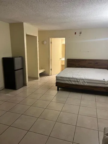 a view of a storage & utility room with a window
