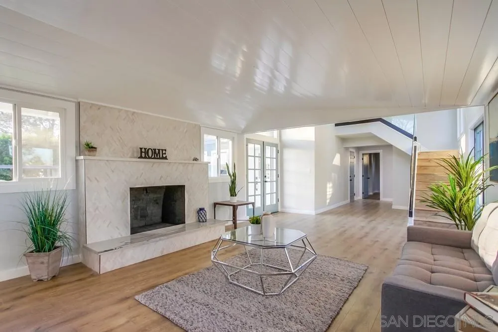 545 Ocean View Avenue Encinitas, CA 92024 - Photo 11 of 75 a living room with furniture and a fireplace