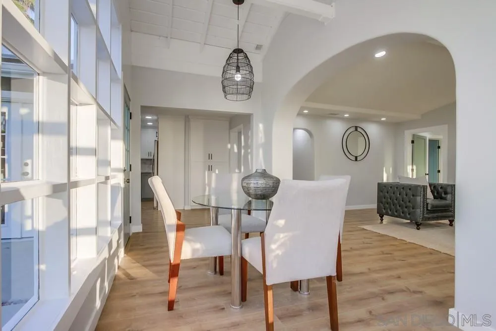 545 Ocean View Avenue Encinitas, CA 92024 - Photo 20 of 75 a view of a dining room with furniture window and wooden floor