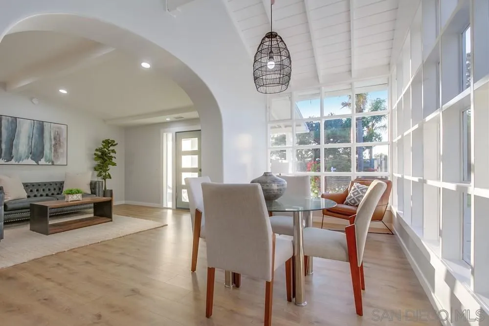 545 Ocean View Avenue Encinitas, CA 92024 - Photo 21 of 75 a view of a dining room with furniture window and wooden floor