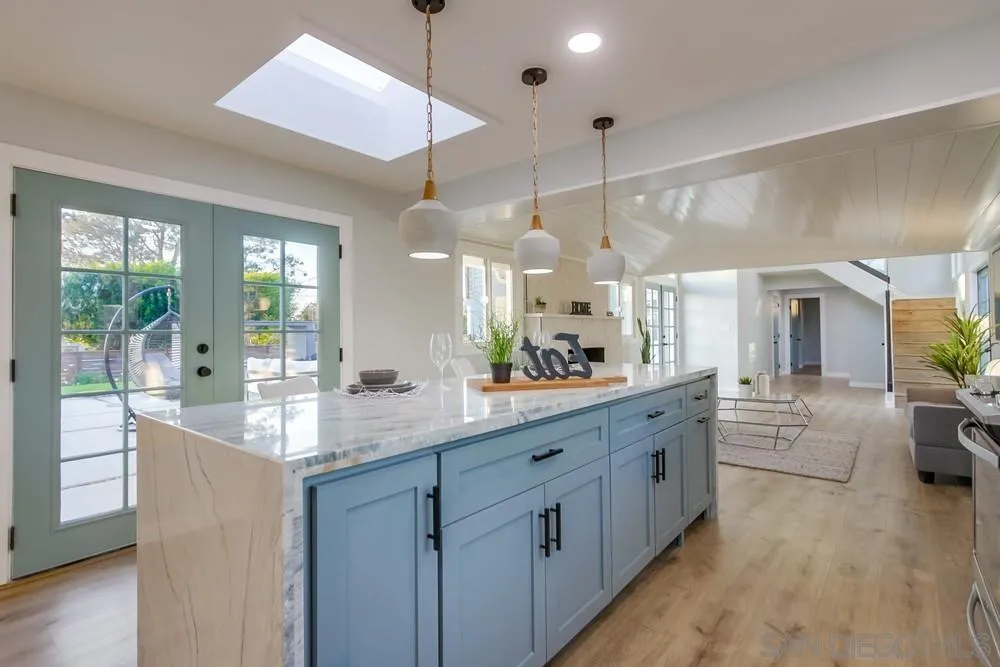 545 Ocean View Avenue Encinitas, CA 92024 - Photo 25 of 75 a large kitchen with kitchen island lots of counter space and windows