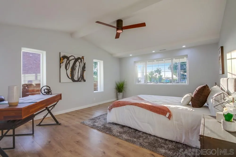 545 Ocean View Avenue Encinitas, CA 92024 - Photo 48 of 75 a bedroom with a bed and a desk