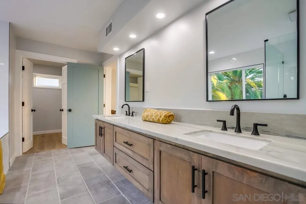 545 Ocean View Avenue Encinitas, CA 92024 - Photo 53 of 75 a bathroom with a double vanity sink mirror and shower