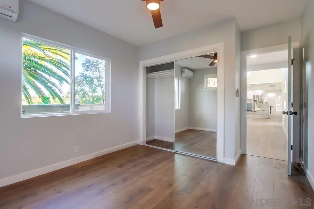 545 Ocean View Avenue Encinitas, CA 92024 - Photo 59 of 75 wooden floor in an empty room with a window