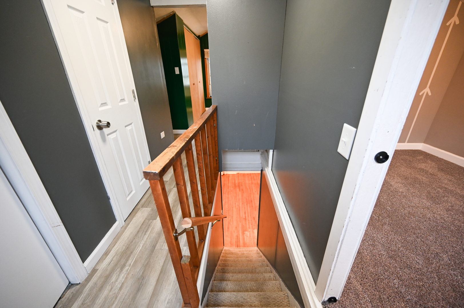 219 South 7th Street DeKalb, IL 60115 - Photo 22 of 30 a view of a staircase with wooden floor and door