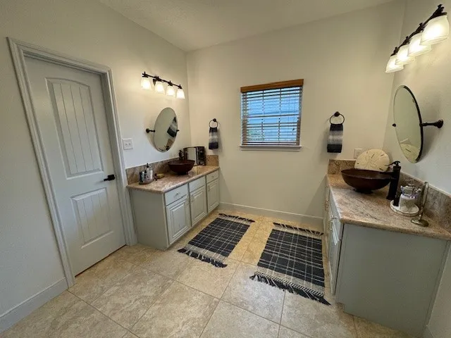 a kitchen with a sink cabinets and window