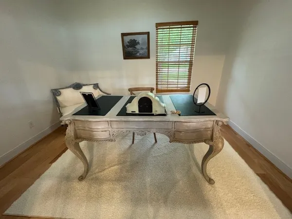a view of dining room and wooden floor