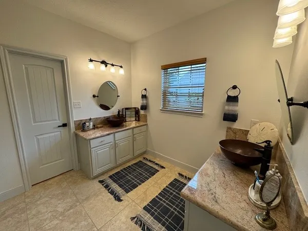 a kitchen with a sink and a stove top oven