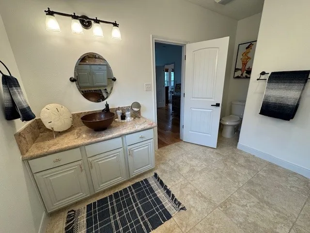 a kitchen with sink and cabinets