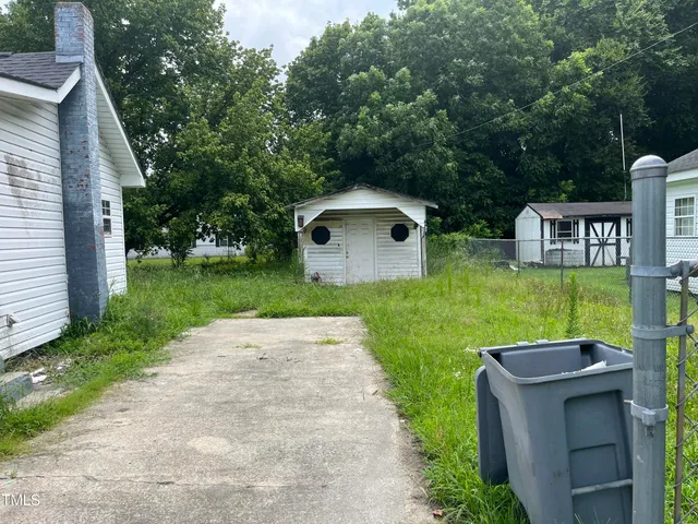 a backyard of a house with lots of green space