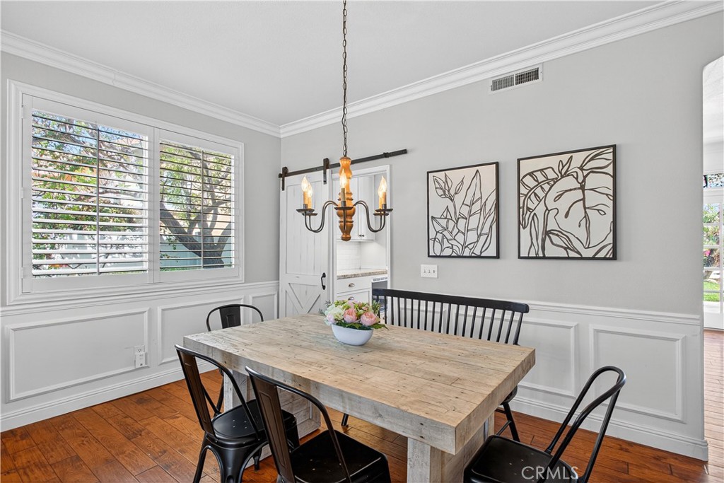 31928 Cercle Chambertin Temecula, CA 92591 - Photo 23 of 74 a view of a dining room with furniture window and wooden floor