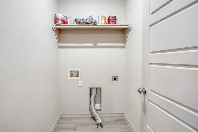 a view of a house with swimming pool and wooden fence