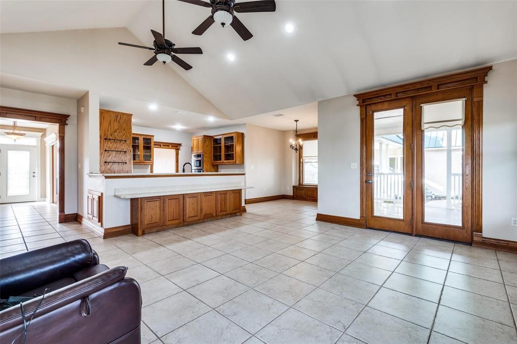 5520 Dido Hicks Road Fort Worth, TX 76179 - Photo 11 of 33 a large room with chandelier fan and windows