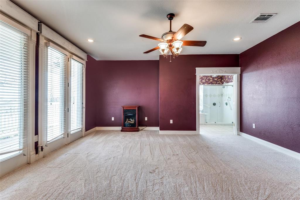 5520 Dido Hicks Road Fort Worth, TX 76179 - Photo 22 of 33 an empty room with windows and fan