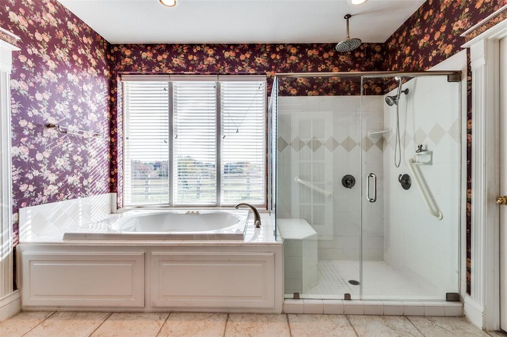5520 Dido Hicks Road Fort Worth, TX 76179 - Photo 24 of 33 a bathroom with a bathtub and a shower