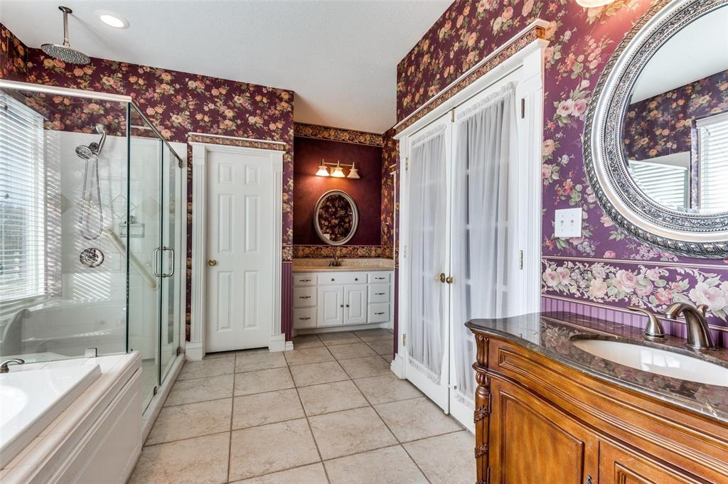 5520 Dido Hicks Road Fort Worth, TX 76179 - Photo 25 of 33 a view of a bathroom with a tub and shower