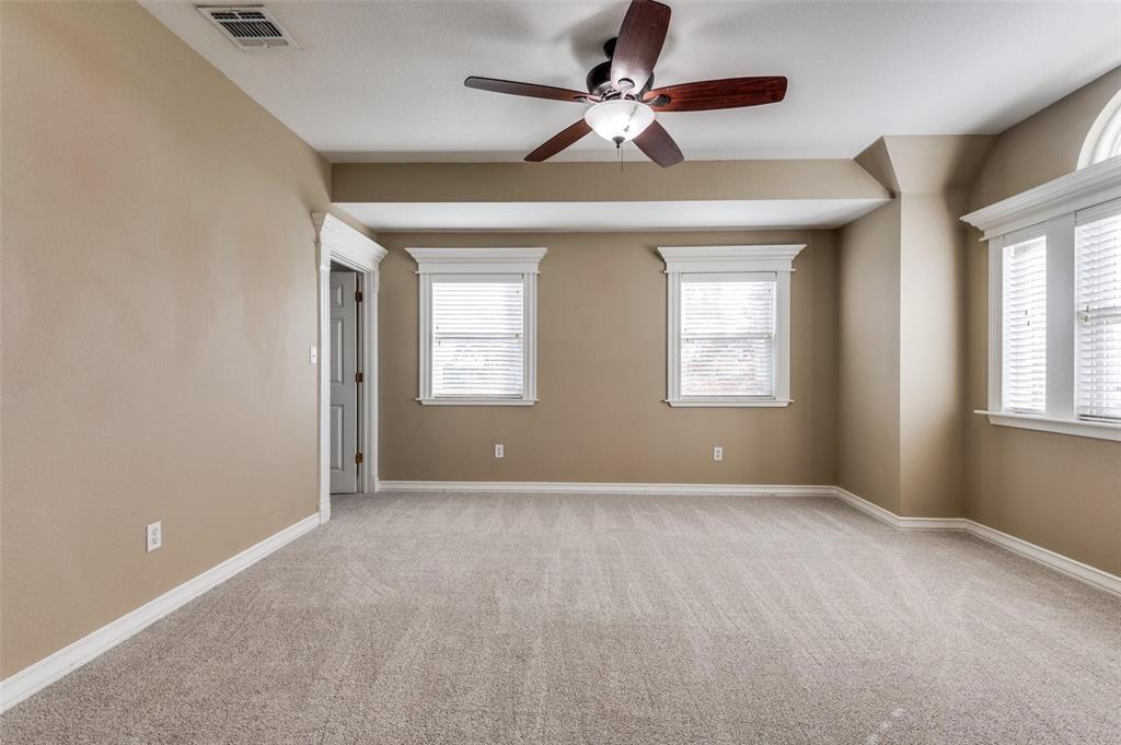 5520 Dido Hicks Road Fort Worth, TX 76179 - Photo 27 of 33 an empty room that has a window and a ceiling fan
