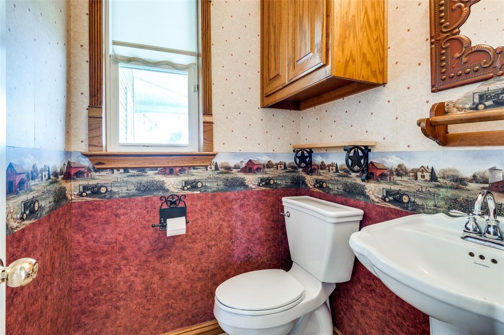 5520 Dido Hicks Road Fort Worth, TX 76179 - Photo 29 of 33 a bathroom with a toilet sink and mirror