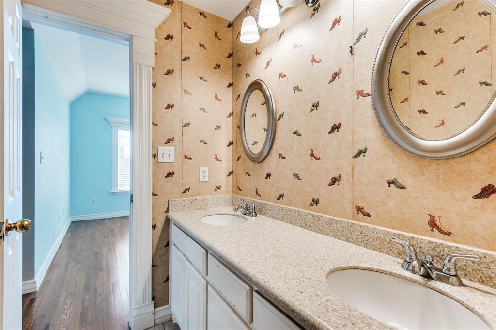 5520 Dido Hicks Road Fort Worth, TX 76179 - Photo 30 of 33 a bathroom with a granite countertop sink and a mirror