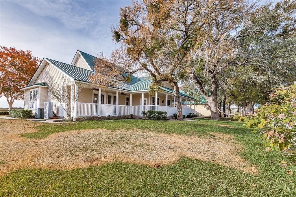 5520 Dido Hicks Road Fort Worth, TX 76179 - Photo 3 of 33 a front view of a house with a yard