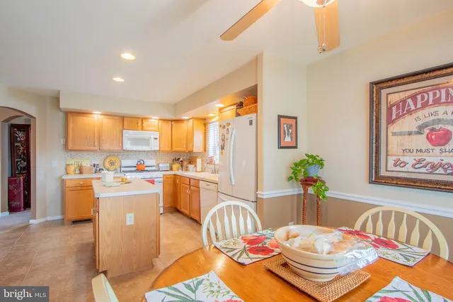 a very nice looking dining room with a table and chairs