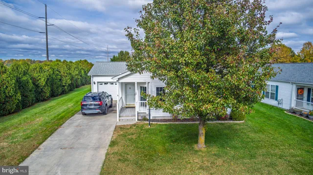 a view of house with outdoor space and garden