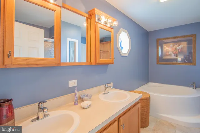 a view of a bedroom with wooden floor and a window