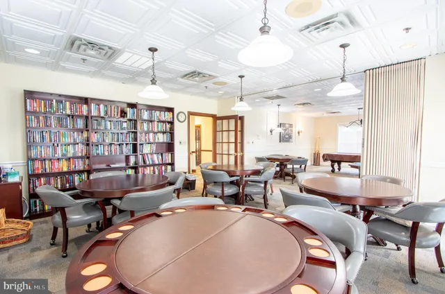 a living room with lots of furniture and a chandelier