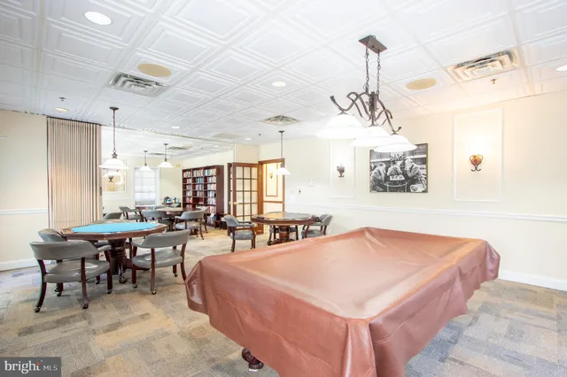 a room with furniture a flat screen tv and a window