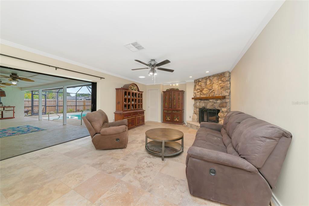4656 Alexander Pope Lane Sarasota, FL 34241 - Photo 13 of 42 a living room with furniture and a large window