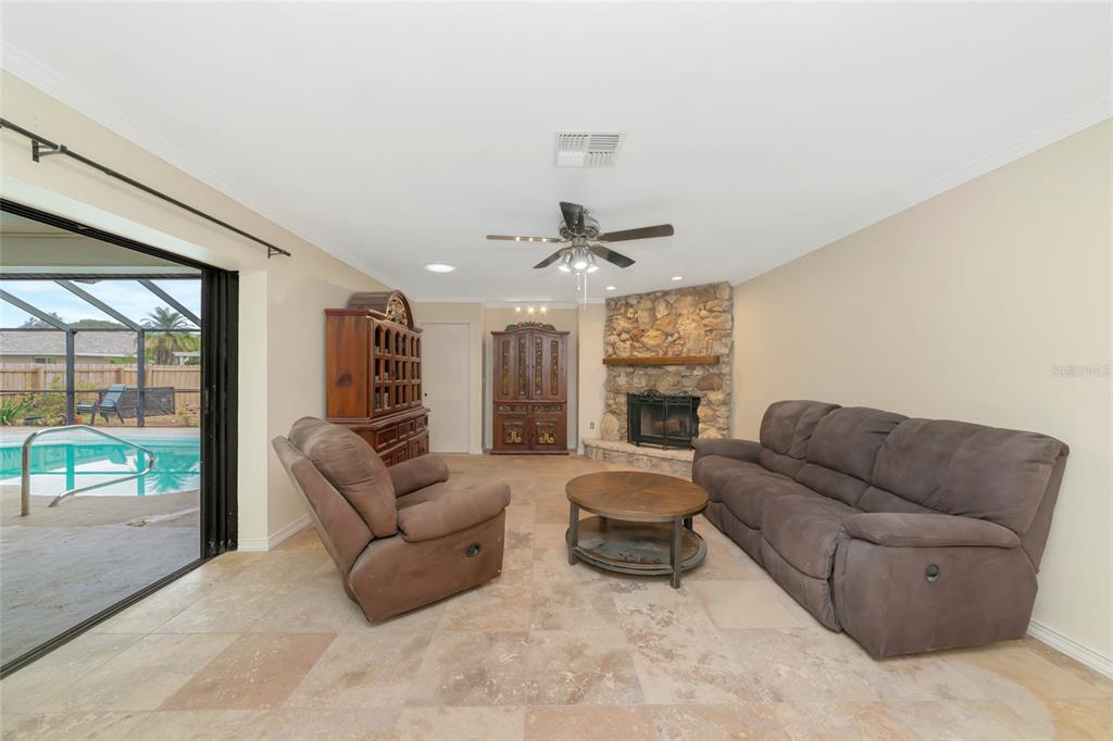 4656 Alexander Pope Lane Sarasota, FL 34241 - Photo 14 of 42 a living room with furniture and a large window