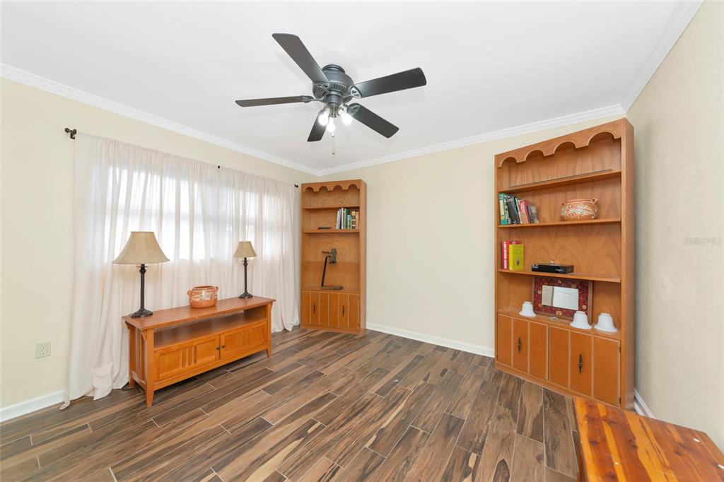 4656 Alexander Pope Lane Sarasota, FL 34241 - Photo 28 of 42 a living room with furniture and a window