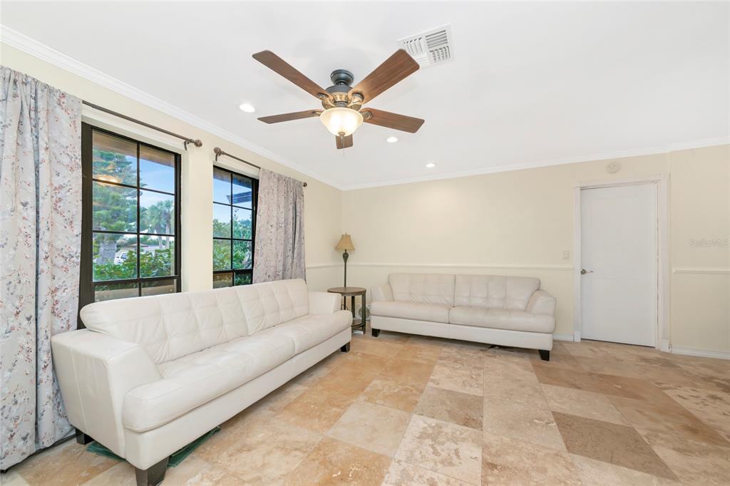 4656 Alexander Pope Lane Sarasota, FL 34241 - Photo 4 of 42 a living room with furniture and a large window