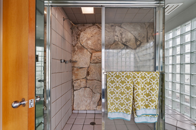 1856 Fort Canyon Road Alpine, UT 84004 - Photo 38 of 49 Shower enclosure featuring natural stone wall accents and white square tiling