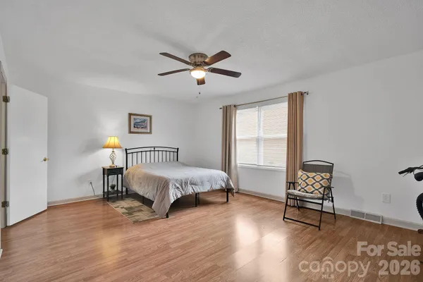 a view of a room with furniture wooden floor and window