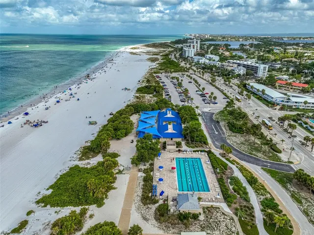 an aerial view of a house with a yard pool outdoor seating and yard