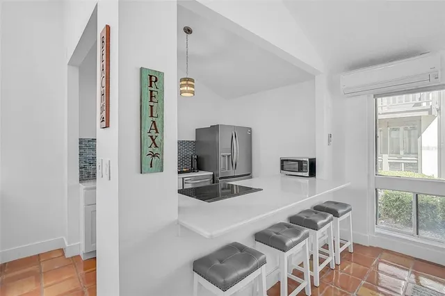 a kitchen with granite countertop a sink and a stove top oven