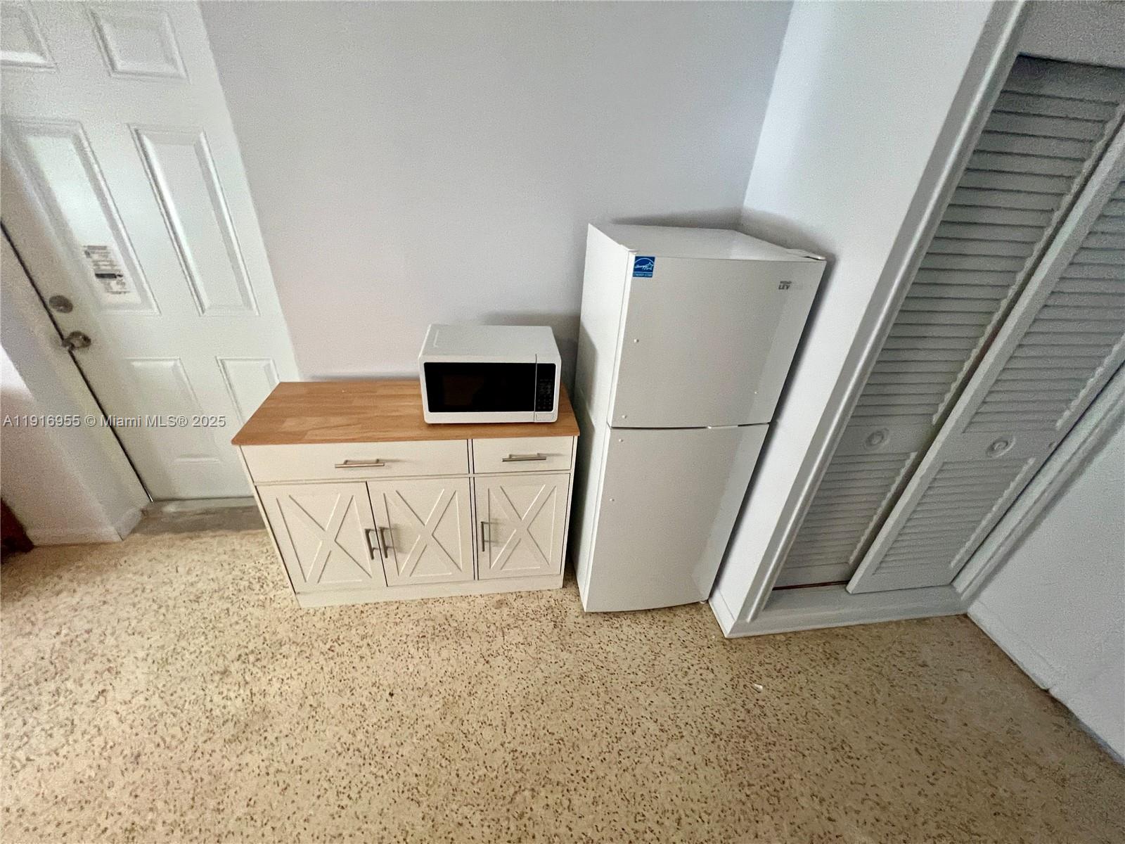 15831 Southwest 100th Court, Unit B Miami, FL 33157 - Photo 3 of 6 a room with a washing machine