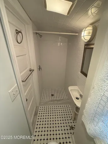 a view of an outdoor dining space with a table and chairs
