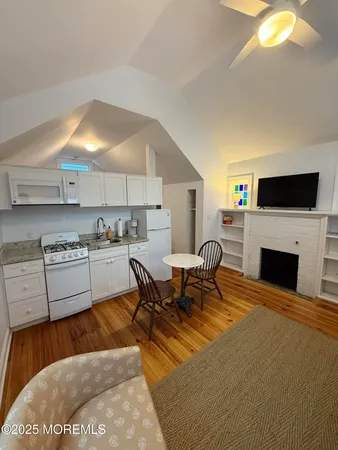 a kitchen with a sink a stove and refrigerator