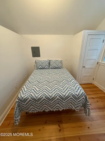 a bathroom with a toilet a sink and a mirror