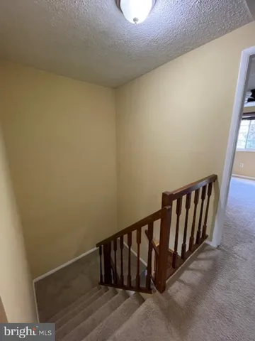 an empty room with a empty space and windows